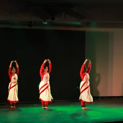 A synchronized group formation from 'Mix & Match'. The dancers are wearing the iconic white and red-bordered sarees of Bengal, used here to create a sense of unity and grace.