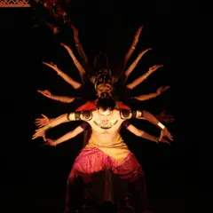 A visually striking formation from "UNMASKED," a production that reinterprets the epic Ramayana. This scene depicts the multi-headed form of Ravana through a powerful arrangement of dancers.