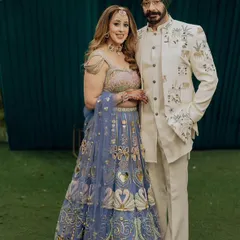 This client looks regal in a custom ivory bandhgala jacket, featuring unique embroidery of elephants and traditional motifs. It's a beautiful example of how we can weave personal stories and heritage into a garment.