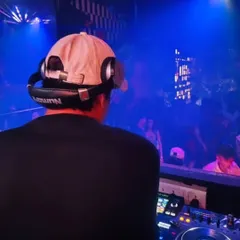 My view from the DJ booth, overlooking a packed house. I use professional lighting and sound to build the energy from the first track to the last.