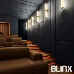 We designed this theater with tiered seating to ensure an unobstructed view from every seat. The combination of plush sofas and dedicated recliners offers flexible comfort, while the dark, acoustically treated walls and ceiling minimize light reflection and sound distortion.