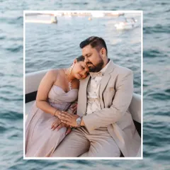 A quiet moment of peace and affection on the water. This beautifully framed shot captures the couple's serene connection amidst the gentle waves.
