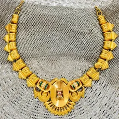 An heirloom in gold, gleaming through the decades. This timeless neckpiece has been a silent witness to 70 years of joy, passed from a grandmother to her daughter and now to her granddaughter.