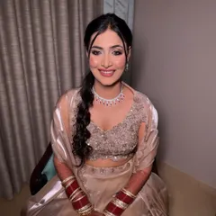 A happy, smiling bride ready for her reception. Bookings are open for 2025, so get in touch to create your dream look.