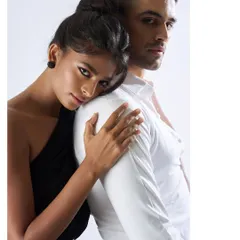 A tender moment from the Malvie editorial. This close-up in black and white emphasizes the emotional connection between the couple, with the simple black stud earring on the female model adding a subtle point of interest.