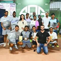 The team behind the champions. A group photo of the coaches and winners after the semi-finals of the Coaches Doubles tournament, celebrating a well-fought competition.
