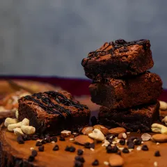 A rustic stack of my nutty brownies, drizzled with chocolate. These are dense, rich, and full of texture from the added nuts, making them a substantial and satisfying treat.