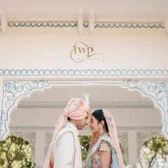 An intimate moment between the couple, framed by the beautiful arches of a Rajasthani palace. My goal is to create a setting so perfect that you can lose yourselves in the moment, while I ensure every detail is flawlessly captured.