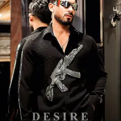 My shirts are made to make a statement, not to blend in. This piece features a powerful, hand-embroidered gun motif in striking silver beadwork, designed for the man who isn't afraid to show his rebellious side.