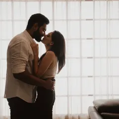 A close-up silhouette against the window, capturing the intimacy of a kiss. This shot is all about feeling, stripping away all distractions to focus on the quiet, powerful bond you share.