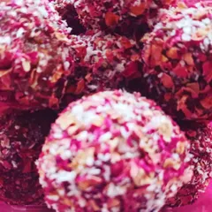 Rose-crusted apple date cinnamon laddoos. These healthy desserts are sweetened only with dates and have no added sugar, oil, or dairy.