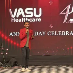 On stage for Vasu Healthcare's 45th Annual Day Celebration. As a corporate emcee, my job is to represent your brand with class and keep the event on schedule, all while making sure the audience feels connected to the celebration.