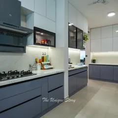 A sleek and functional U-shaped kitchen with a modern contemporary design. We used a two-tone scheme with matte blue base cabinets and glossy white upper cabinets, complemented by a premium quartz marble countertop and backsplash.