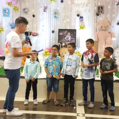 Lining up the kids for a team game. I organize activities that encourage teamwork and friendly competition, making sure everyone feels like a winner.