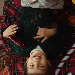 A playful, upside-down view of Christmas joy. I love capturing the silly, carefree moments that show a child's true personality during our sessions.