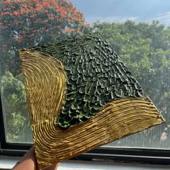 A finished piece from our textured art workshop. Using special materials, we create stunning 3D effects that you can feel. This one, with its green and gold design, looks incredible in the light.