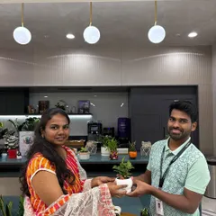 The best part of my job is seeing a happy new plant parent. Here I am handing over a freshly potted plant during a corporate wellness event.
