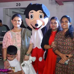 Our Mickey Mouse mascot posing with guests at a birthday party. Mascots are a great way to create fun photo opportunities for everyone.