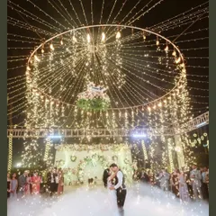 A first dance under a canopy of fairy lights and fireworks. We specialize in capturing these magical, cinematic moments that feel like they're straight out of a movie.