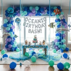 Dive into an underwater adventure with our Oceanic Birthday Bash theme. This elaborate decoration includes a massive balloon arch in ocean blues, purples, and teals, accented with foil balloons of sea creatures like dolphins, jellyfish, and clownfish. It’s a complete setup that transforms any space into a sea world.