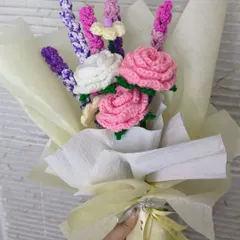 A mixed bouquet of handmade flowers, featuring pink roses and lavender stems. We can create custom arrangements with your favorite flowers.