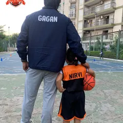 Guiding the next generation. A photo of me with one of our youngest academy members, Nirvi, ready for her training session.