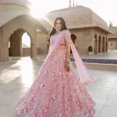 Bathed in the golden hour light of Jaipur, Brinda is a vision in her custom pastel lehenga. My creative direction for this shot was to capture the sheer joy and fairytale quality of her look against the sun-kissed architecture of the Fairmont.