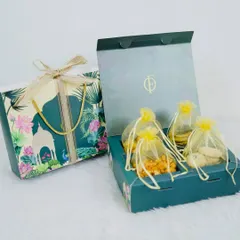 Our premium Diwali gift box is designed to impress. Featuring a beautiful floral motif, it opens to reveal four pouches of our finest handmade snacks and sweets, making it an elegant choice for festive gifting.