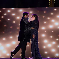 A tender moment on the Sangeet stage, as the couple shares a slow dance under the spotlight.