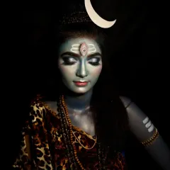 A full-body shot showcasing the complete Lord Shiva look, including the blue body paint, traditional attire, and Rudraksha beads. This demonstrates a complete character creation from head to toe.