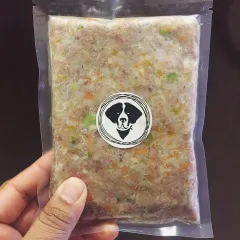This is what fresh dog food looks like. You can see the real ingredients through the clear, vacuum-sealed pack. It's a complete meal, ready to serve.