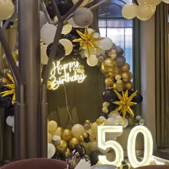 A side view of the 50th birthday decor, showing how it integrates into the venue's aesthetic.