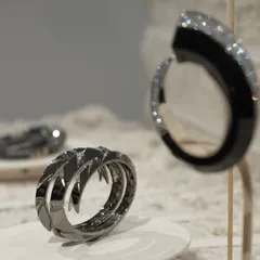 A detail of the contemporary jewelry pieces displayed within the exhibition we designed. The raw, natural landscape we created serves to enhance the sculptural quality of each piece.