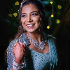 The final look for Shriya's reception. Her radiant smile and the glamorous smokey eye makeup created a truly memorable and stunning bridal moment.
