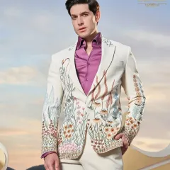 A fresh take on the formal tuxedo, this ivory jacket is adorned with vibrant, multi-colored floral embroidery. It's a perfect example of how I blend traditional craftsmanship with contemporary design for a standout cocktail or sangeet outfit.
