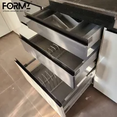 Our drawer systems are built for heavy use and organization. This image shows a three-tier tandem drawer setup with dedicated racks for plates and bowls, keeping your crockery secure and easy to access.
