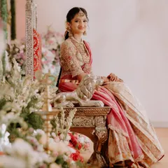 This young client looks like a princess in her custom-designed half saree. The pink and gold ensemble with a heavily embroidered blouse is perfect for her half saree function.