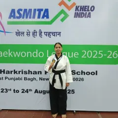 Anushka with her bronze medal for Poomsae at a Khelo India event. Poomsae requires immense precision and focus.