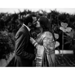 A timeless black and white moment from a post-wedding shoot. Stripping away color lets the pure emotion of the kiss and the connection between the couple become the entire story.