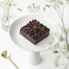 This is our Real Chocolate Overload brownie, and it lives up to its name. Made with pure couverture chocolate and real butter, it's incredibly fudgy and rich. This is the kind of quality that started our entire journey.