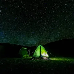 This is what a good night's sleep looks like. Our tent glowing under a sky full of countless stars on the Pin Parvati trek.