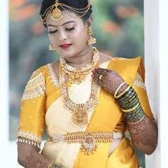 The radiant bride Pooja on her wedding day. I designed this classic yellow and off-white silk saree and blouse for her muhurtham.