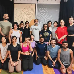A happy group photo of our community after a rejuvenating yoga session. The smiles and positive energy reflect the supportive and light-filled space we cultivate together.
