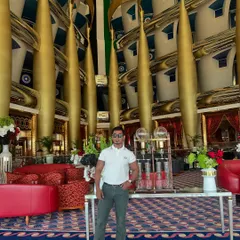 Even in the opulent lobby of a luxury hotel, our custom grey jeans hold their own, proving that great-fitting denim can be dressed up for any occasion.