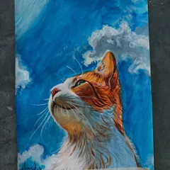 Another view of the finished cat painting, showing the vibrant blue sky and the cat's soft fur.