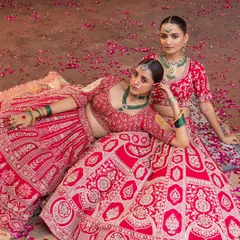In this bridal campaign, my creative direction and styling aimed to create a scene of opulent romance. The rich red lehengas, intricate jewelry, and a bed of rose petals come together to tell a story of modern regality and shared moments.