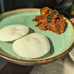 Here is my Kerala Chicken Roast, with its deep, savoury flavours, paired with soft, fluffy Vatteyappam. Vatteyappam is a steamed rice and coconut cake, and it's perfect for soaking up all the delicious gravy from the roast. This combination is available on pre-order.