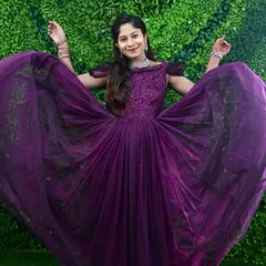Feel like a queen during your maternity shoot. This flowing purple gown is a client favorite and photographs beautifully, especially when you want to show off its full skirt.