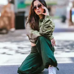 A similar kneeling pose, this time with a direct and powerful gaze at the camera. This shot is full of attitude and perfect for a rapper's or artist's portfolio.