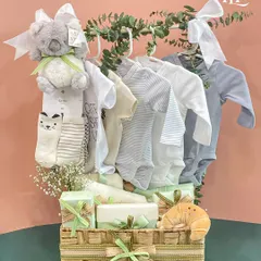 A full view of the jute basket hamper, featuring a miniature clothing rack with adorable onesies and a cuddly koala toy. It's a perfect blend of practical and cute.